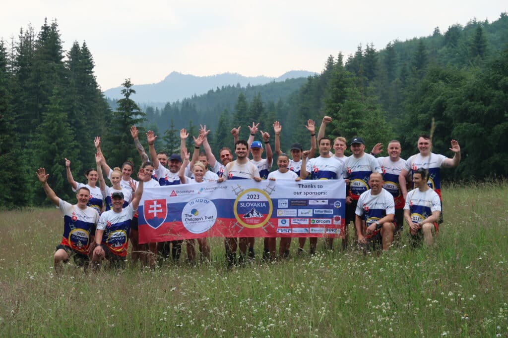 Messagemaker team and friends posing with the charity banner