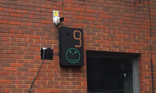 A Smiley Activated Message (SAM) sign showing 9mph and a smiley face in LEDs - Part of the Vehicle Activated Speed Sign range