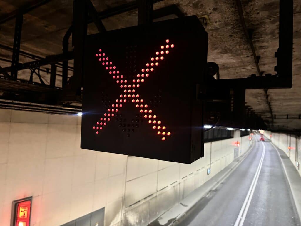 Cubic Lane Control Sign in a Tunnel for TFL showing a Red Cross