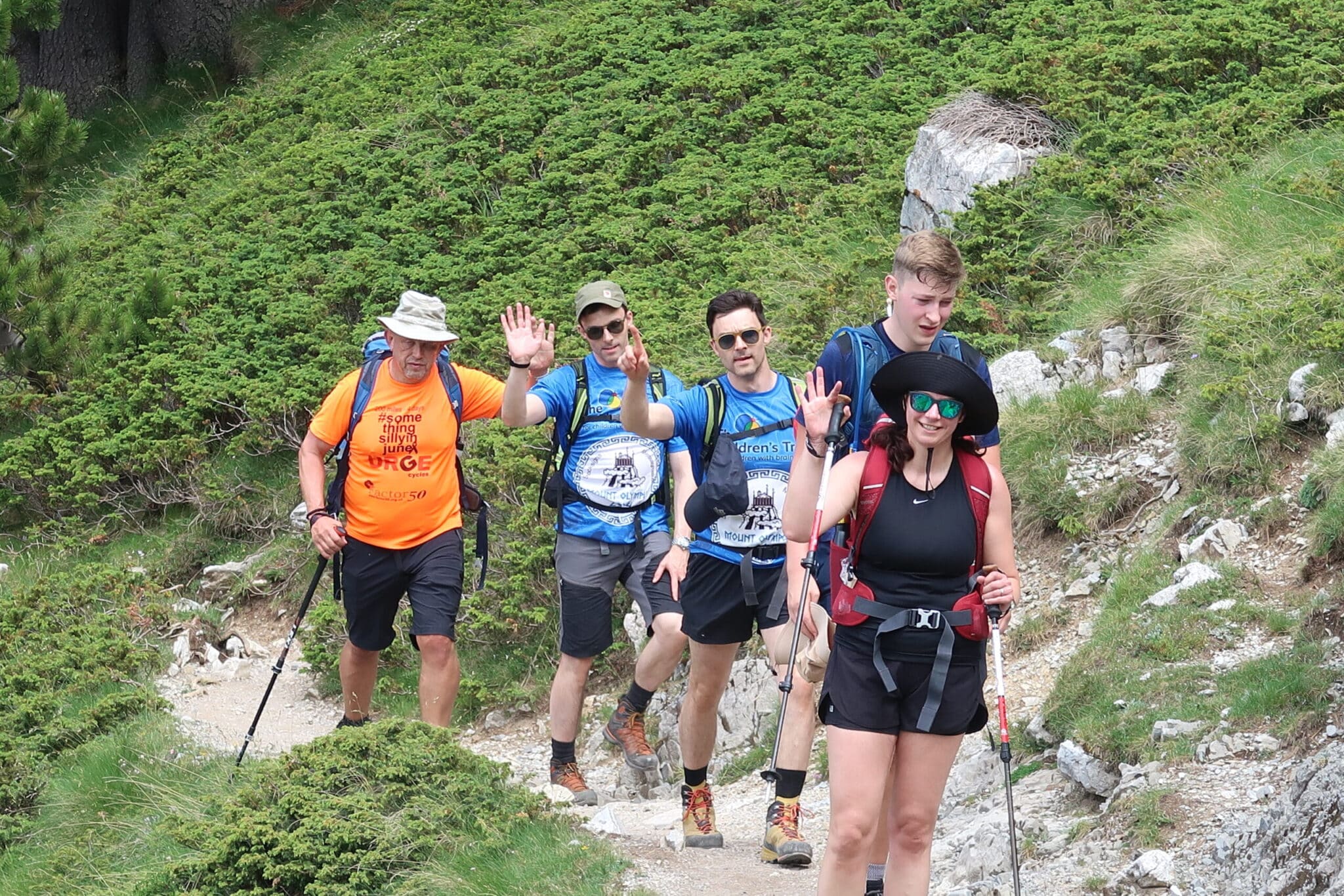 The Olympus Team walking on a Narrow Path towards the top of the mountain